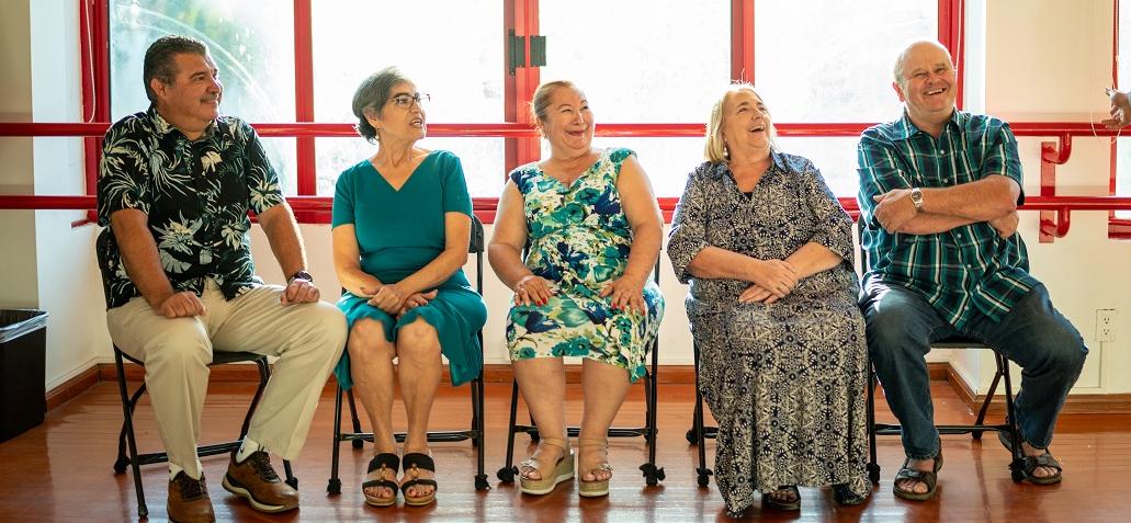 Old people sitting in a studio