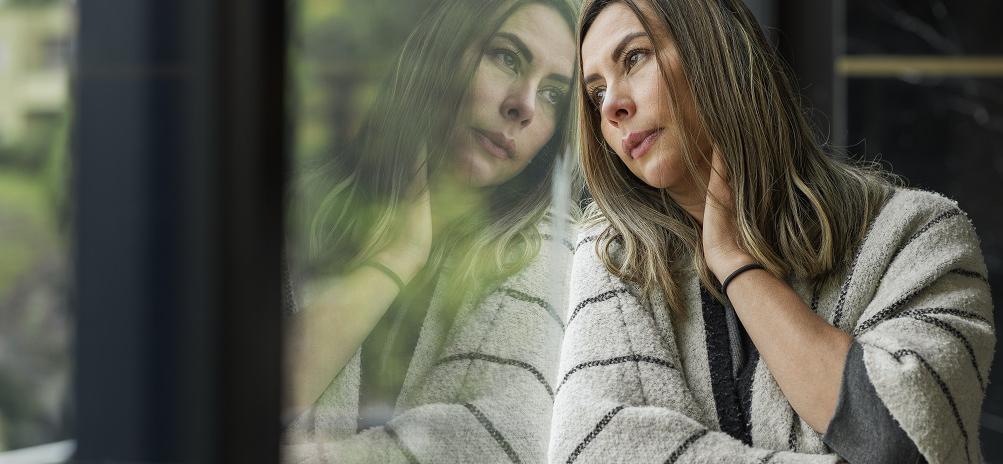 Colombian woman leaning on the window