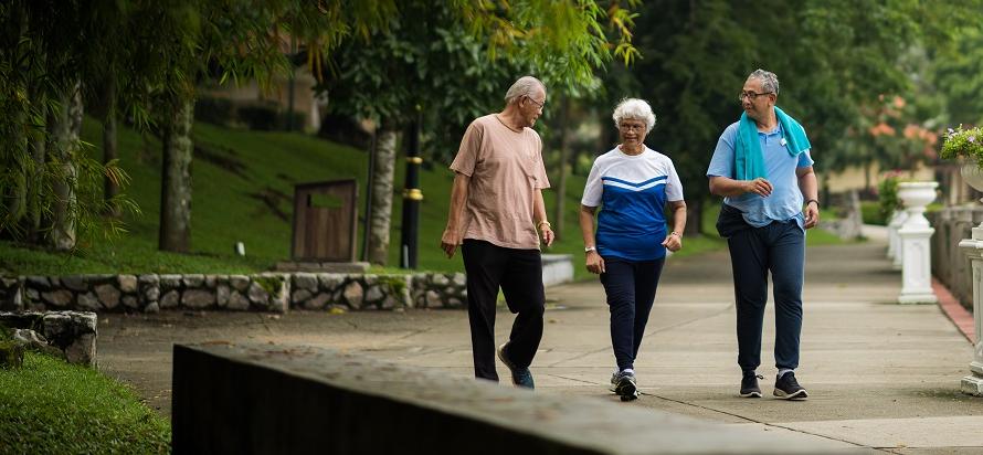Senior friends walking in the park