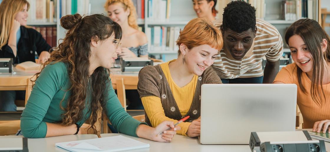 Young students learning from laptop