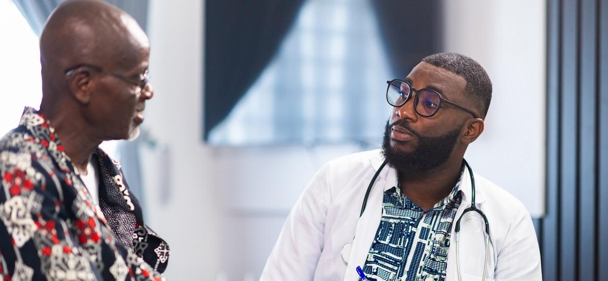 african doctor with patient