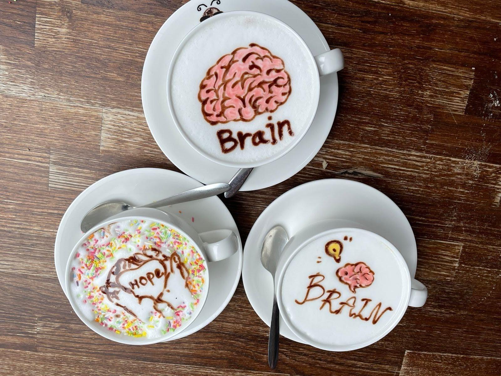 coffees with brain and hope written in the foam