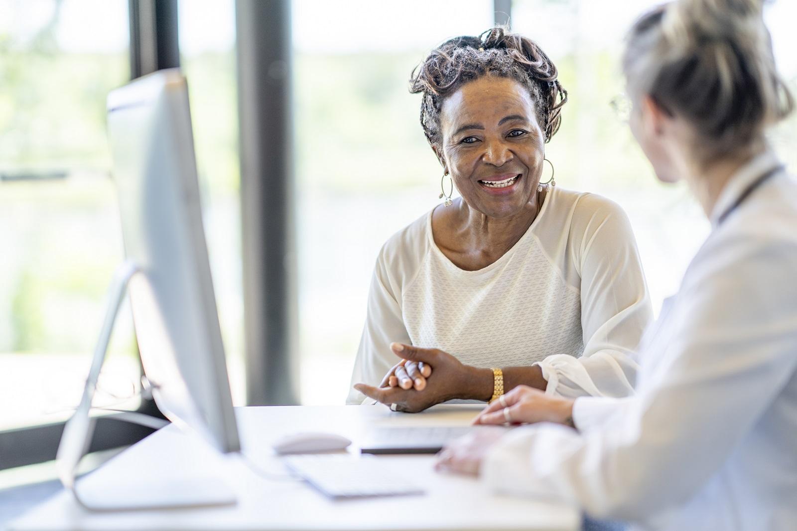 lady with doctor and computer monitor