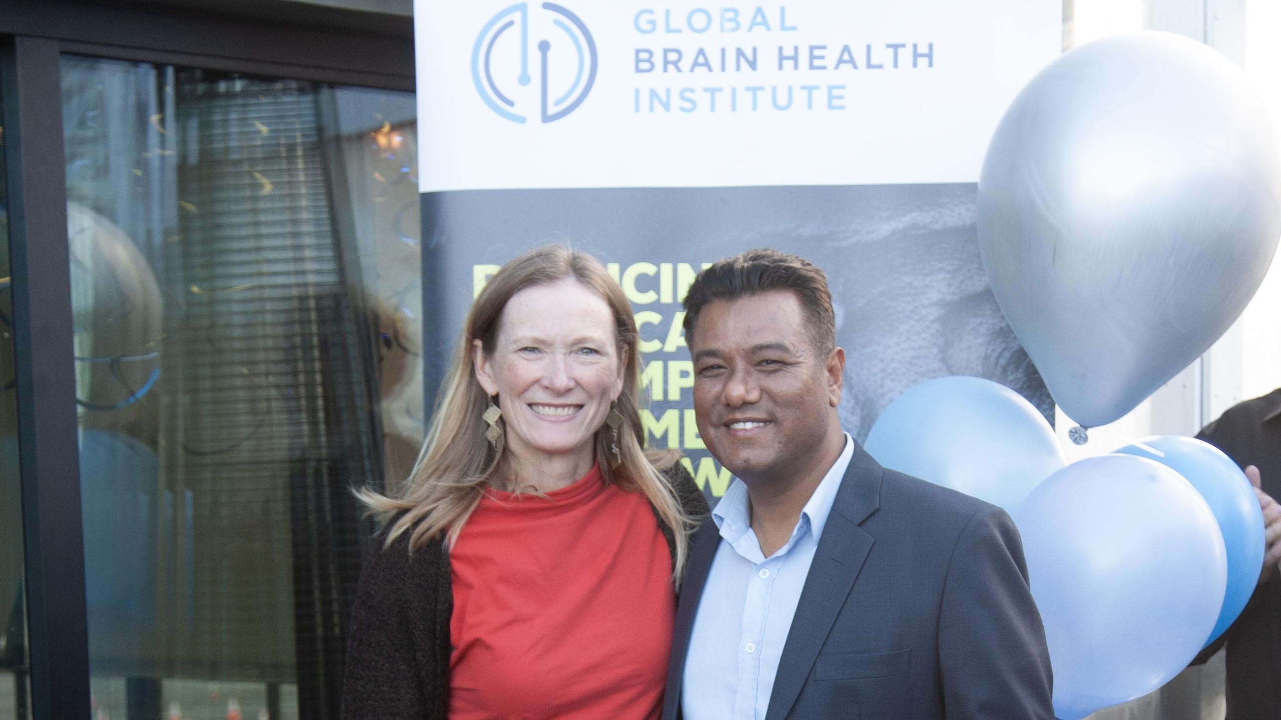 Kate Possin and Umesh Bogati smiling together at the graduation celebration for the 2023 Atlantic Fellows for Equity in Brain Health.