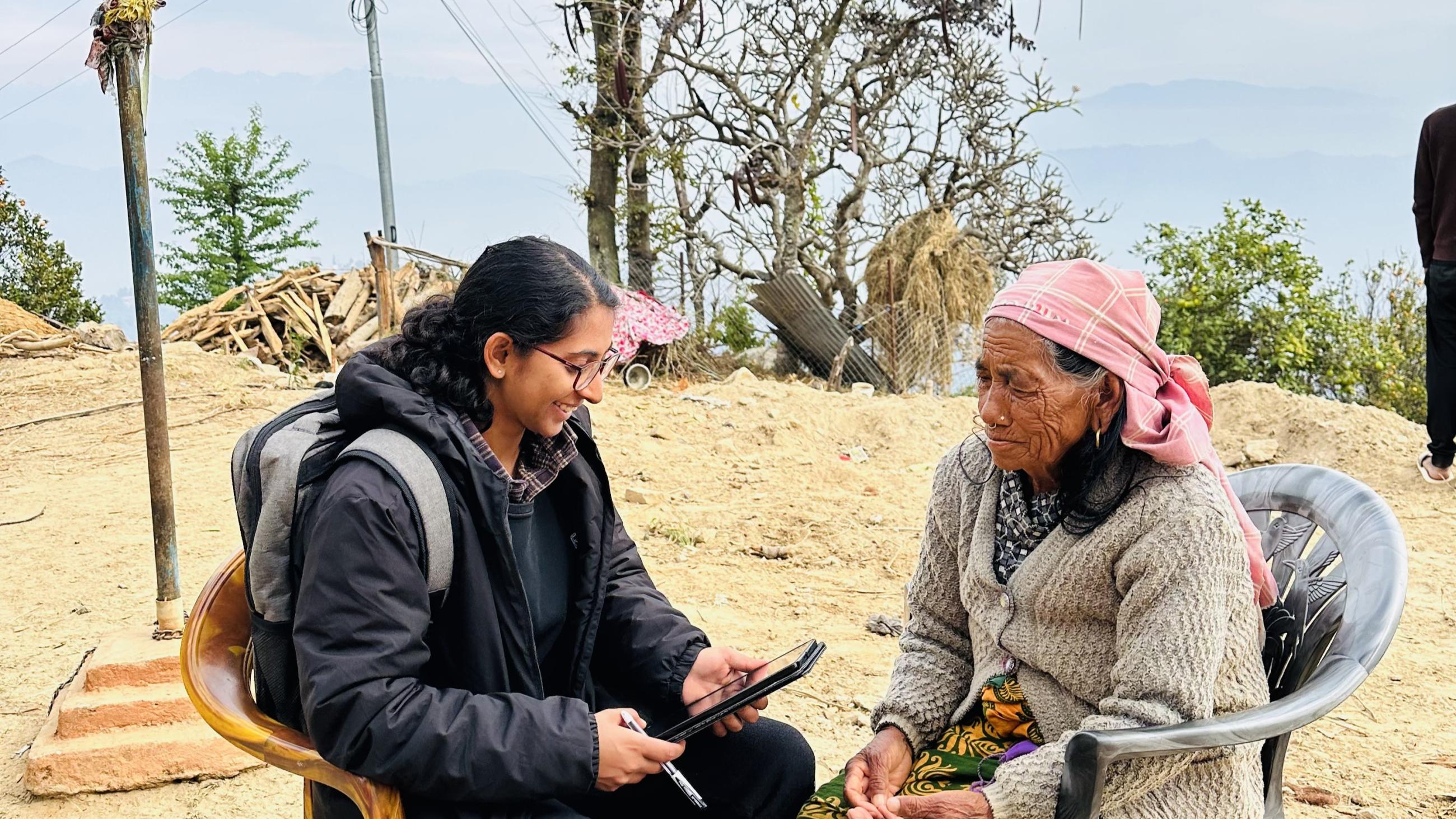 A member of Atlantic Fellow Prabha Shrestha's research team conducts a community interview with an older adult in rural Nepal as part of a GBHI Pilot Award project.