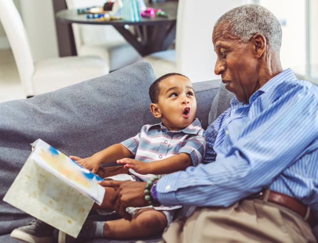 grandfather and grandson reading