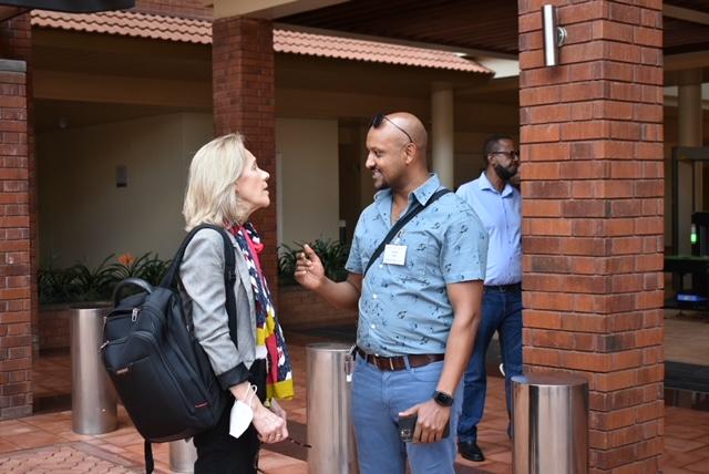 Two people face each other to talk