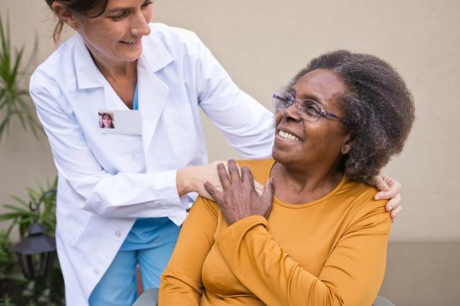 smiling older lady with nurse