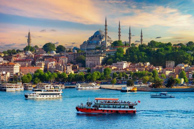 Touristic sightseeing ships and skyline in Istanbul