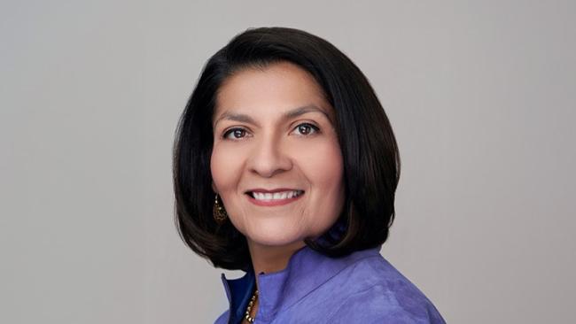 Portrait of Maria Carrillo smiling against a neutral background