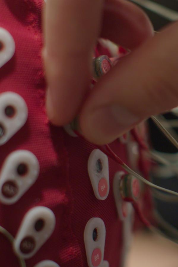 Atlantic Senior Fellow David Loughrey attaches electrodes in a shot for the hear/say documentary film