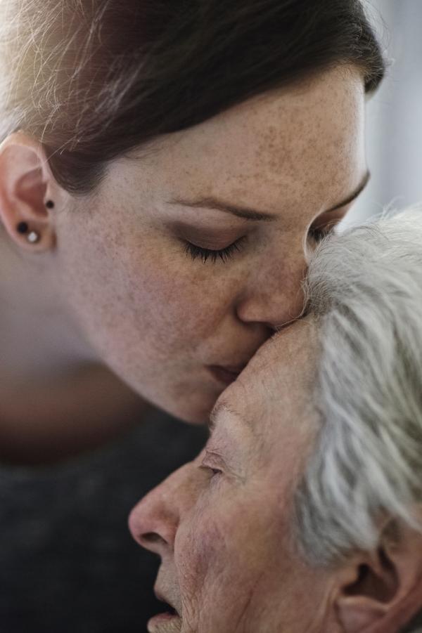 sick older lady with daughter