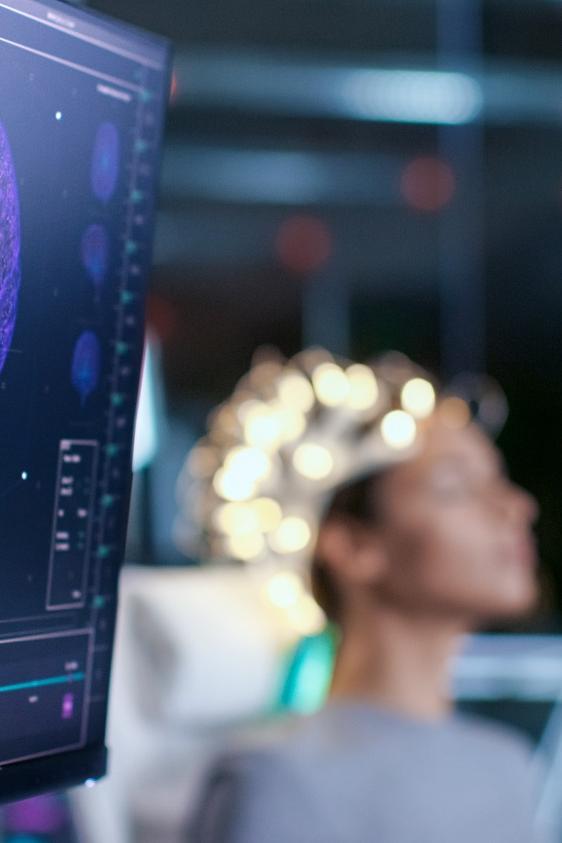 EEG display with person in background