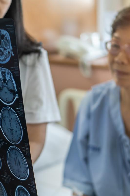 Doctor diagnosing elderly woman