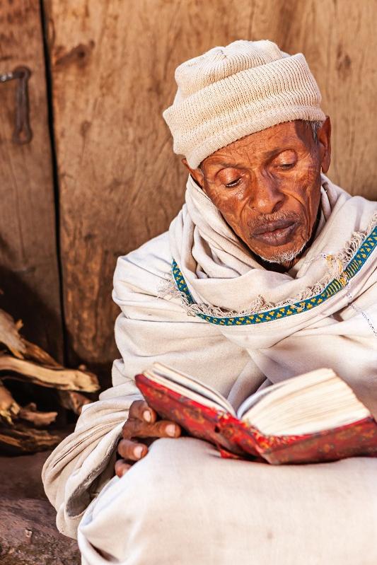 Old man reading a book