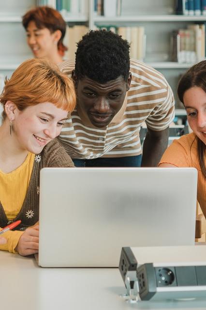 Young students learning from laptop