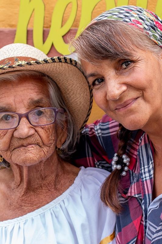 Colombisn older woman and daughter who is smiling