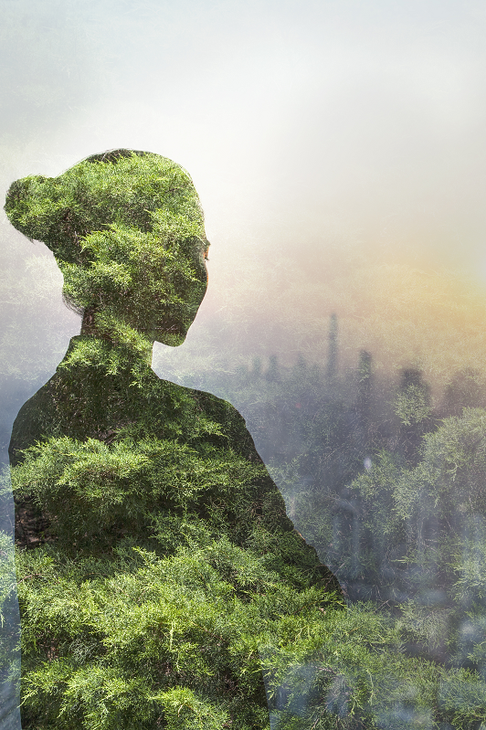 woman and trees and city