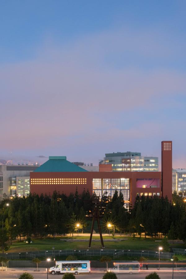 The William J. Rutter Center and Koret Quad, center, surrounded by Genentech Hall on the far left, and Sandler Neurosciences Center, second from right, and Rock Hall, on the far right, photographed a half hour before sunrise, from the 3rd Street Parking Garage, at Mission Bay.