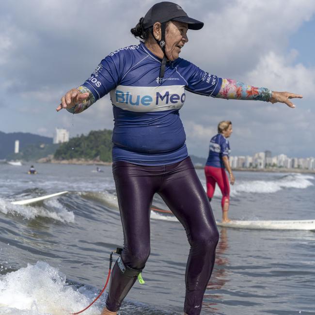 Older person surfing in Brazil - photo by Alex Kornhuber