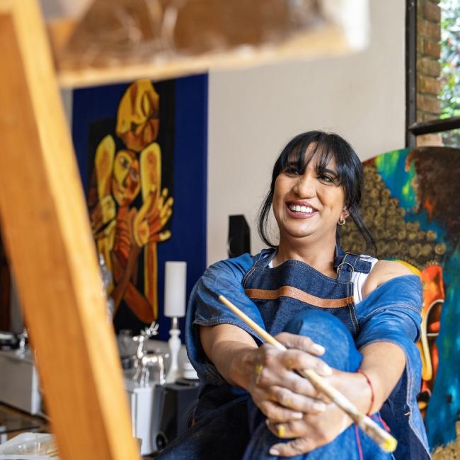 Artist with paintings