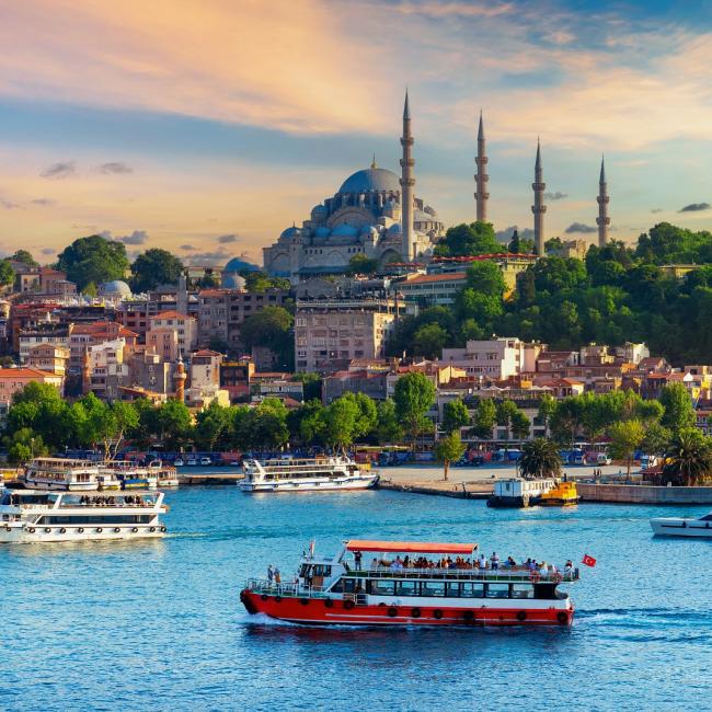 Touristic sightseeing ships and skyline in Istanbul