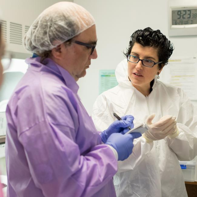 Lea Grinberg and colleagues review notes during a clinicopathological session at the Sandler Neurosciences Center.