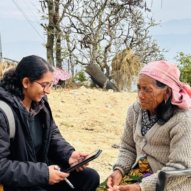 A member of Atlantic Fellow Prabha Shrestha's research team conducts a community interview with an older adult in rural Nepal as part of a GBHI Pilot Award project.