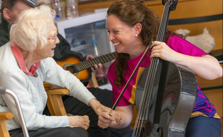 Atlantic Fellow Grainne Hope plays cello and engages with older adult