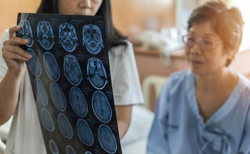 Doctor diagnosing elderly woman