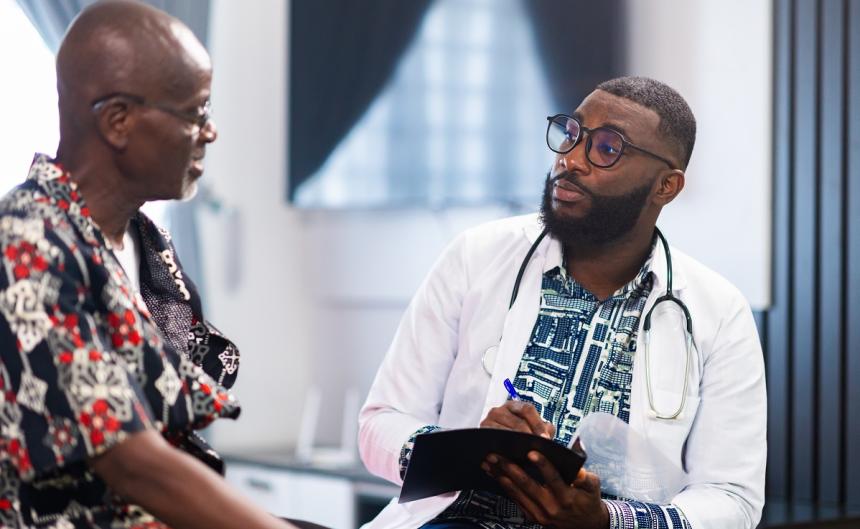 african doctor with patient