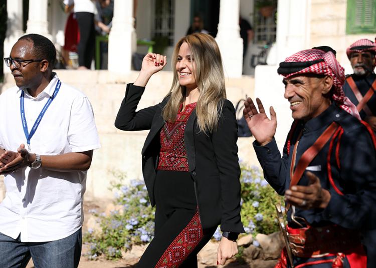 Atlantic Senior Fellow Tala Al-Rousan engages with community members at a refugee meeting in Jordan