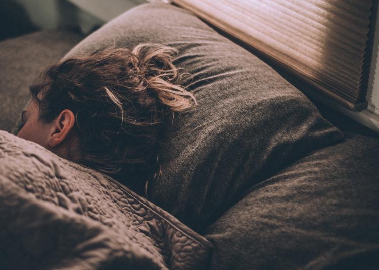 Person sleeping in bed