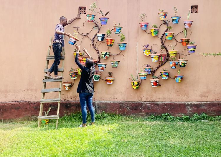 Participants assemble an art piece for the Bloom Social Therapeutic Horticultural Project for the Elderly
