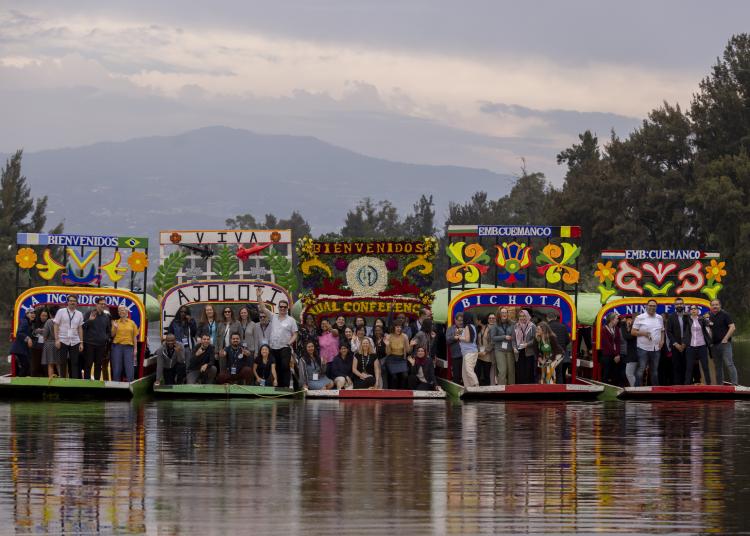 Members of the GBHI community ride on Trajeras in Mexico City.