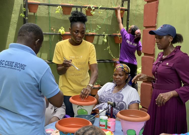 Bloom garden project people painting flower pots