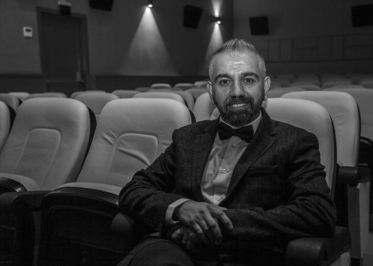 Armagan Uysal seated in theater