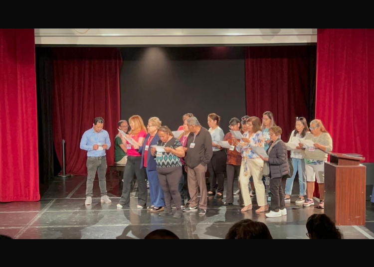 Caregiver festival workshop participants perform Dani Macri's song, &quot;Coco&quot;