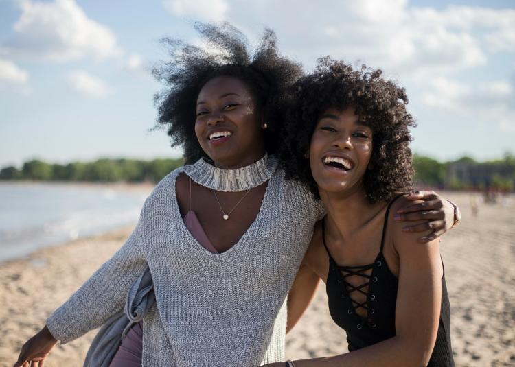 Annual report 23-24 cover happy women outside