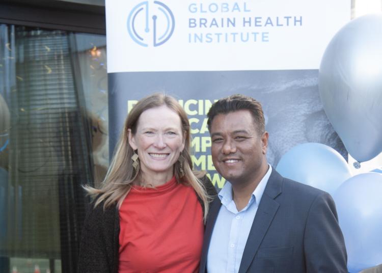 Kate Possin and Umesh Bogati smiling together at the graduation celebration for the 2023 Atlantic Fellows for Equity in Brain Health.