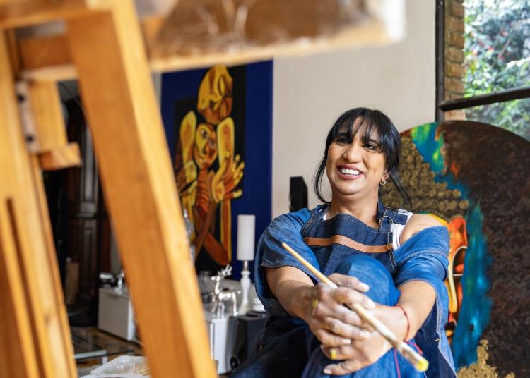 Artist with paintings