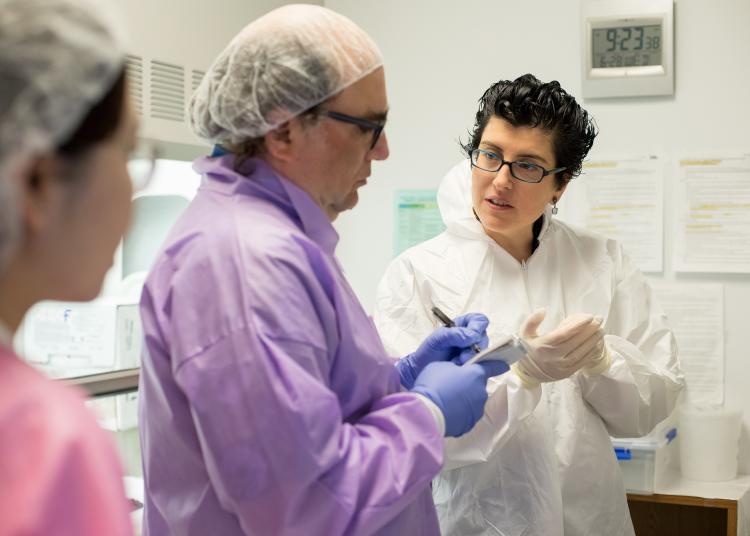 Lea Grinberg and colleagues review notes during a clinicopathological session at the Sandler Neurosciences Center.