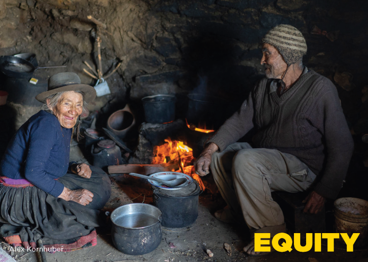 older man and women with cooking pots and open fire