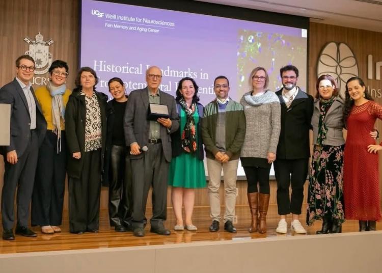 Bruce Miller stands with Atlantic Fellows, regional mentors, and colleagues after receiving a recognition award during a ceremony in Porto Alegre, Brazil.