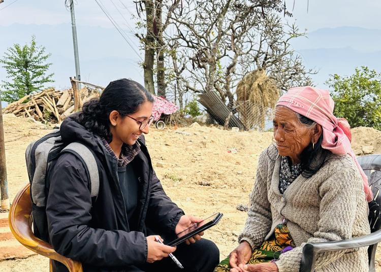 A member of Atlantic Fellow Prabha Shrestha's research team conducts a community interview with an older adult in rural Nepal as part of a GBHI Pilot Award project.